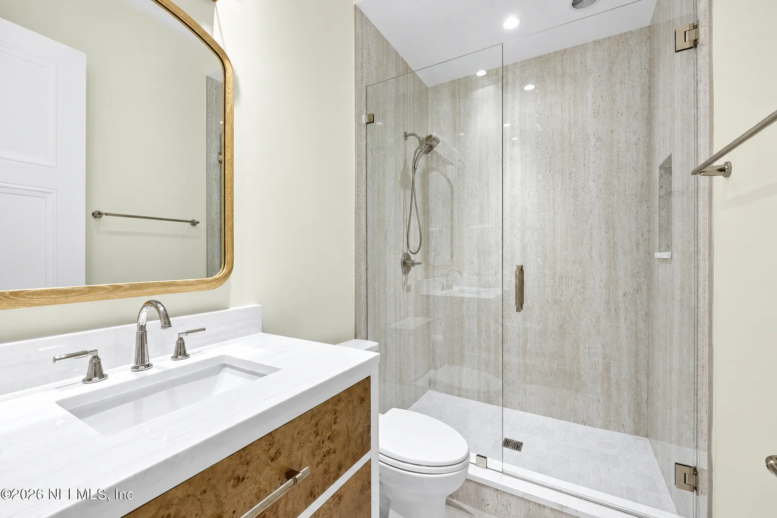 Warm wood guest bathroom vanity cabinetry at the Glen Kernan Residence in Jacksonville by Finer Touch